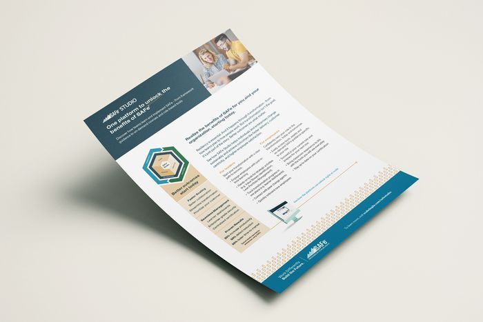 A mockup flyer for the "SAFe Studio Platform" featuring a dark teal header and discusses unlocking the benefits of OKRs. The document is shown at an angle, giving a 3D effect.